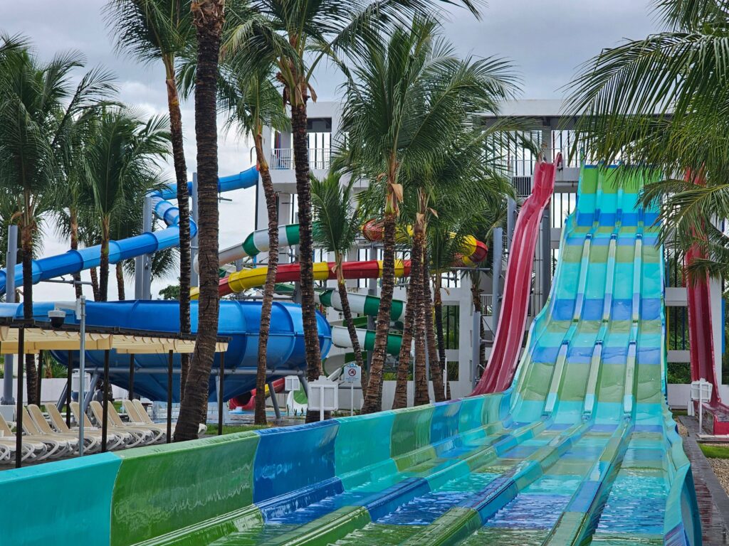 waterpark slides and palm trees at the riu palace bavaro resort